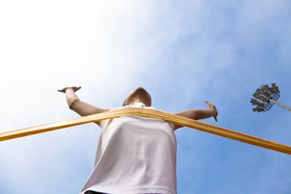 Winning athlete with cloud background