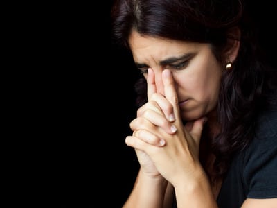 Stressed hispanic woman with a thoughtful look