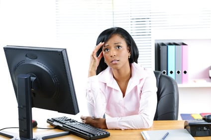 Worried black businesswoman at desk